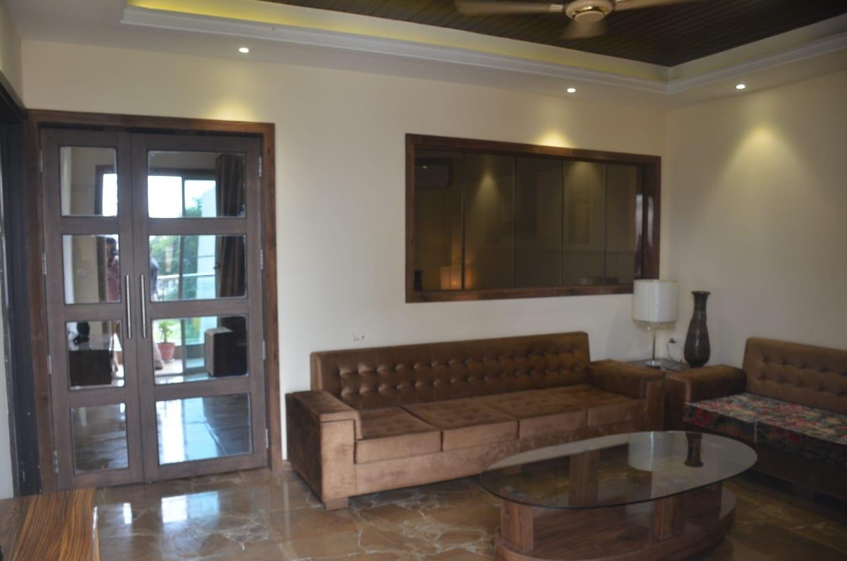 Hospitality lounge with marble floor and tufted sofas